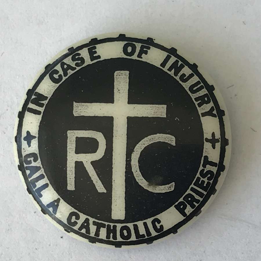 Scare button badge In case of injury call a catholic priest