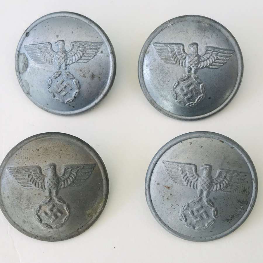 Four NSDAP political buttons  made by Assmann