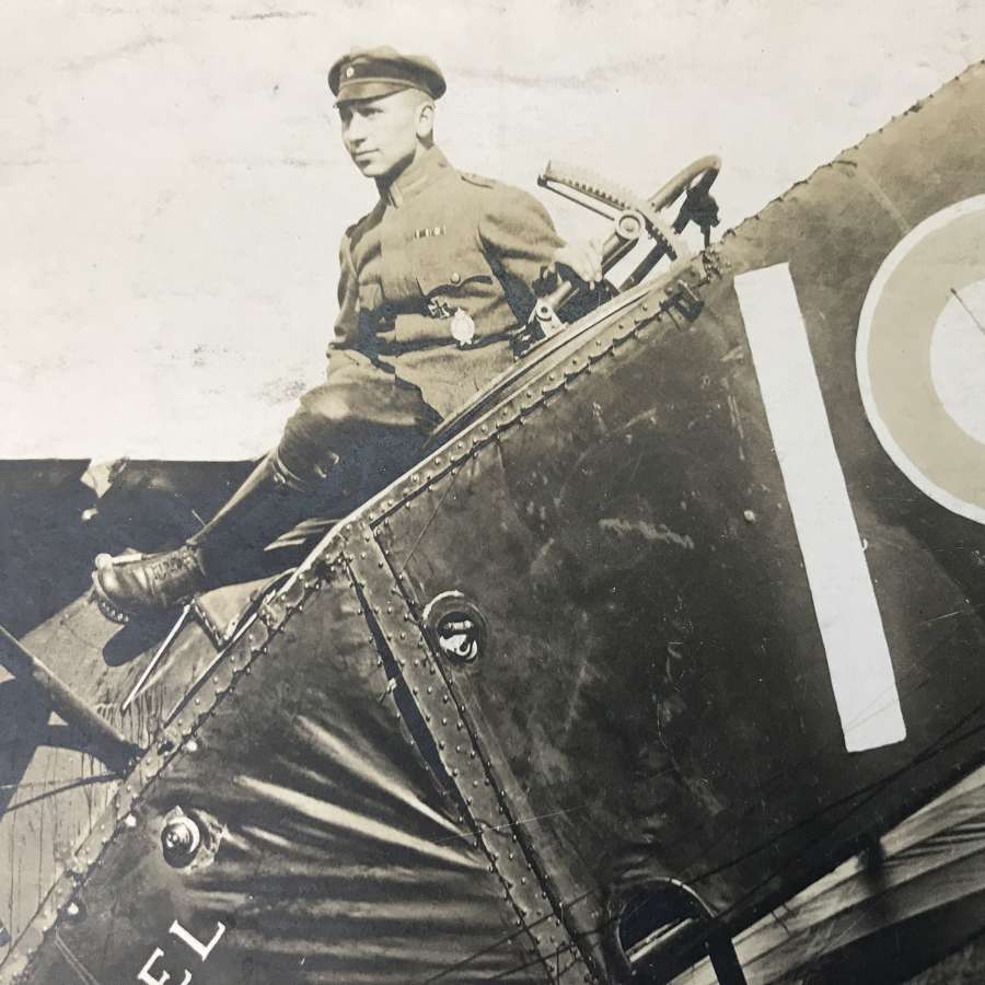 A Postcard Of a German pilot sitting on a Bristol fighter
