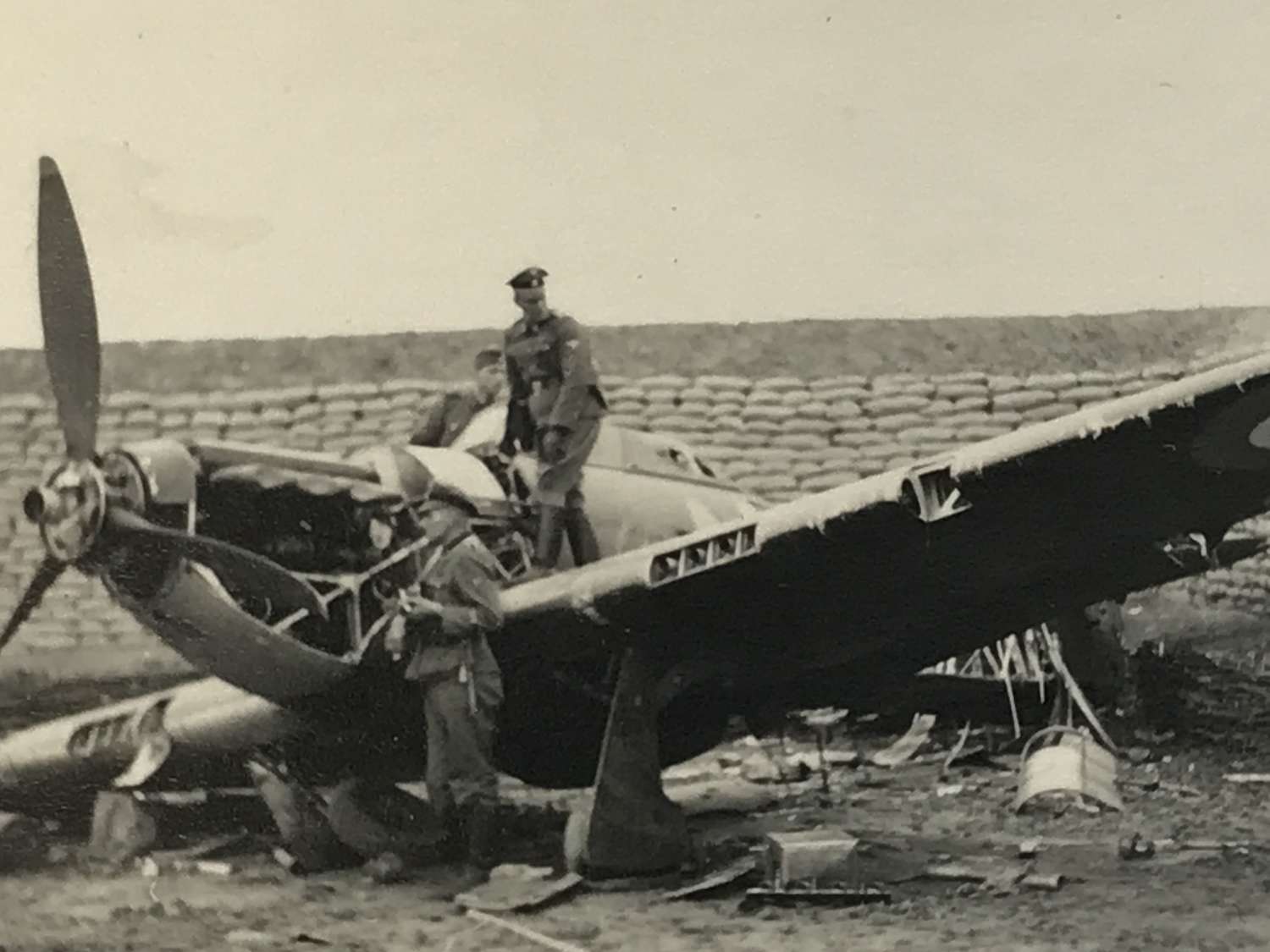 Photograph of hurricane fighter being inspected by SS troops
