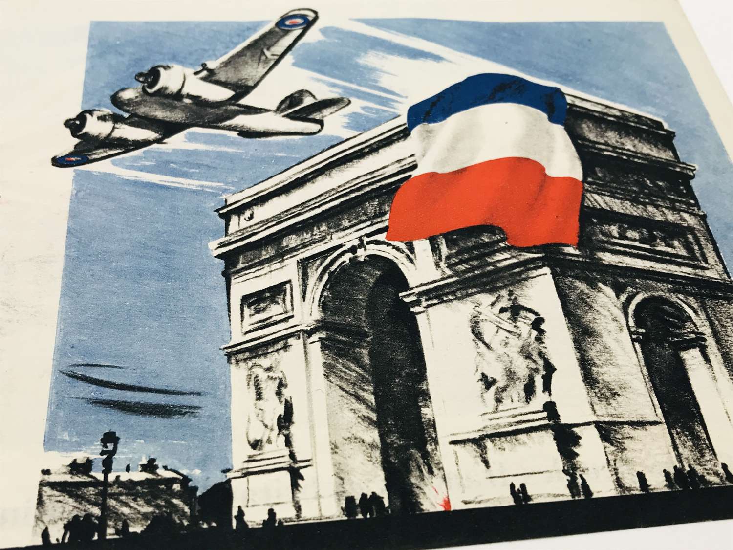 Propaganda leaflet dropping of the tricolour on the Arc de Triomphe