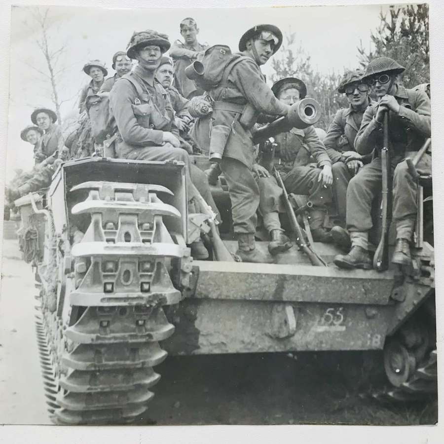 Press photo of British infantry and Churchill Tank