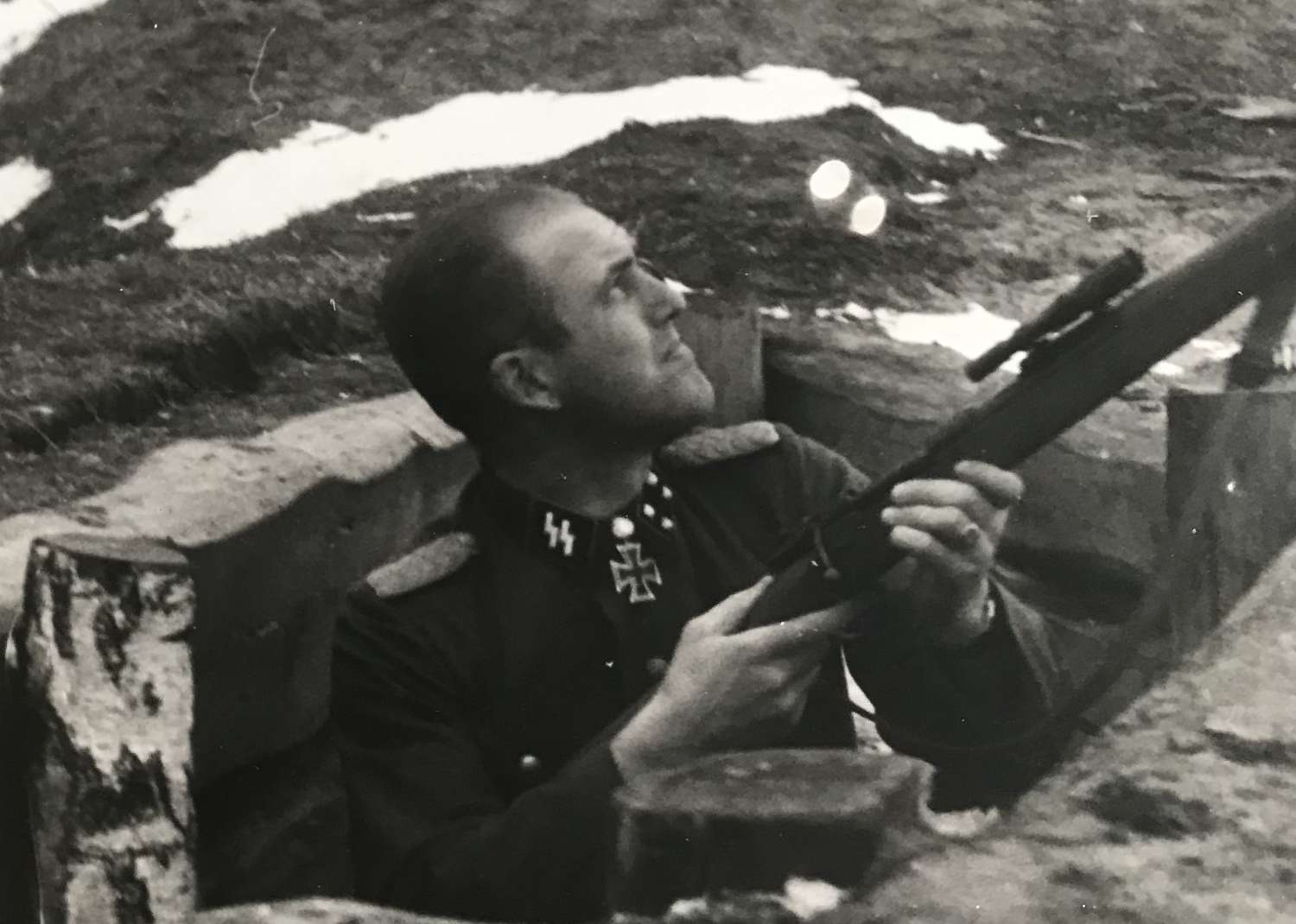 Press photo of Waffen SS officer with snipers rifle dated, 1944