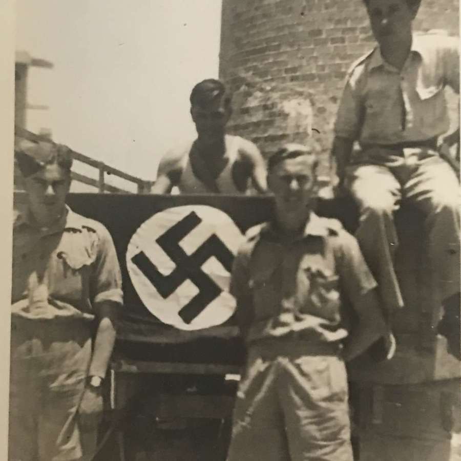 A photo of British soldiers with captured German flag