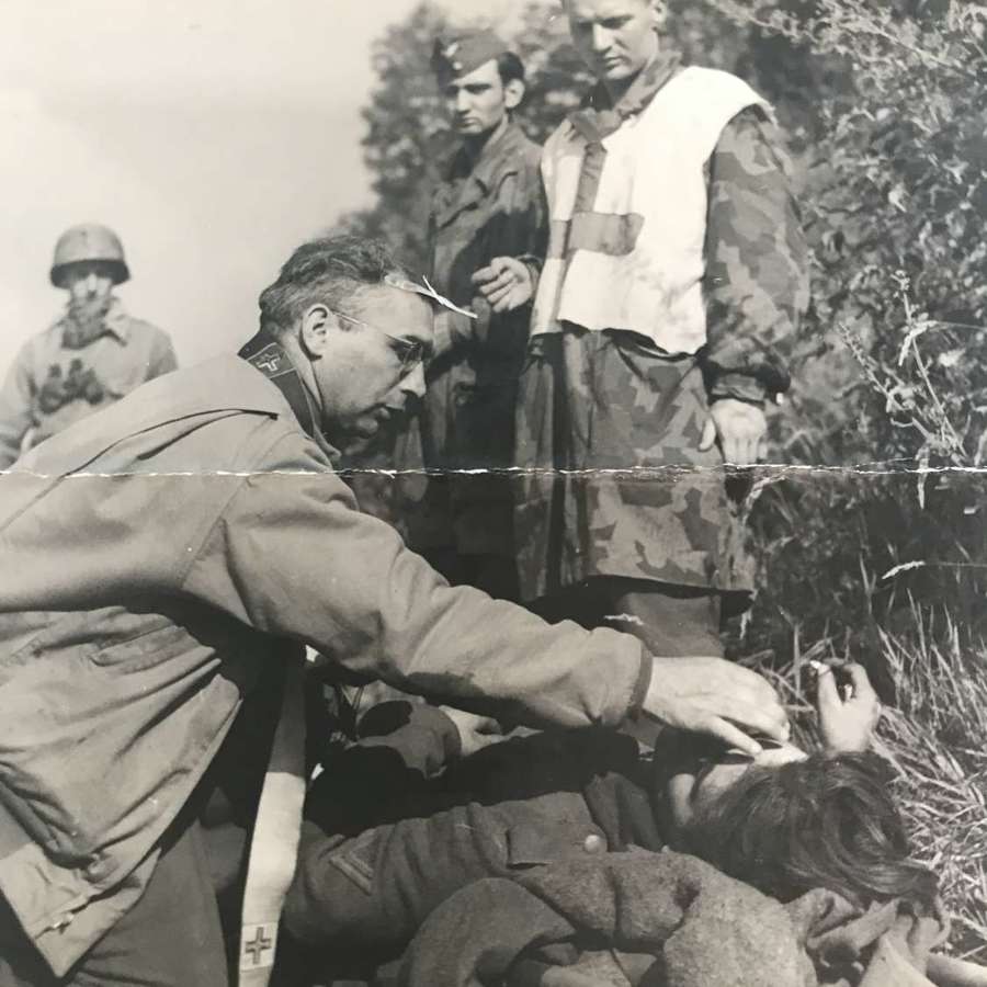 Allied press photo of Normandy Casualty, with US Chaplin, August 1944