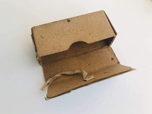 An empty Mauser p08 9mm ammo box